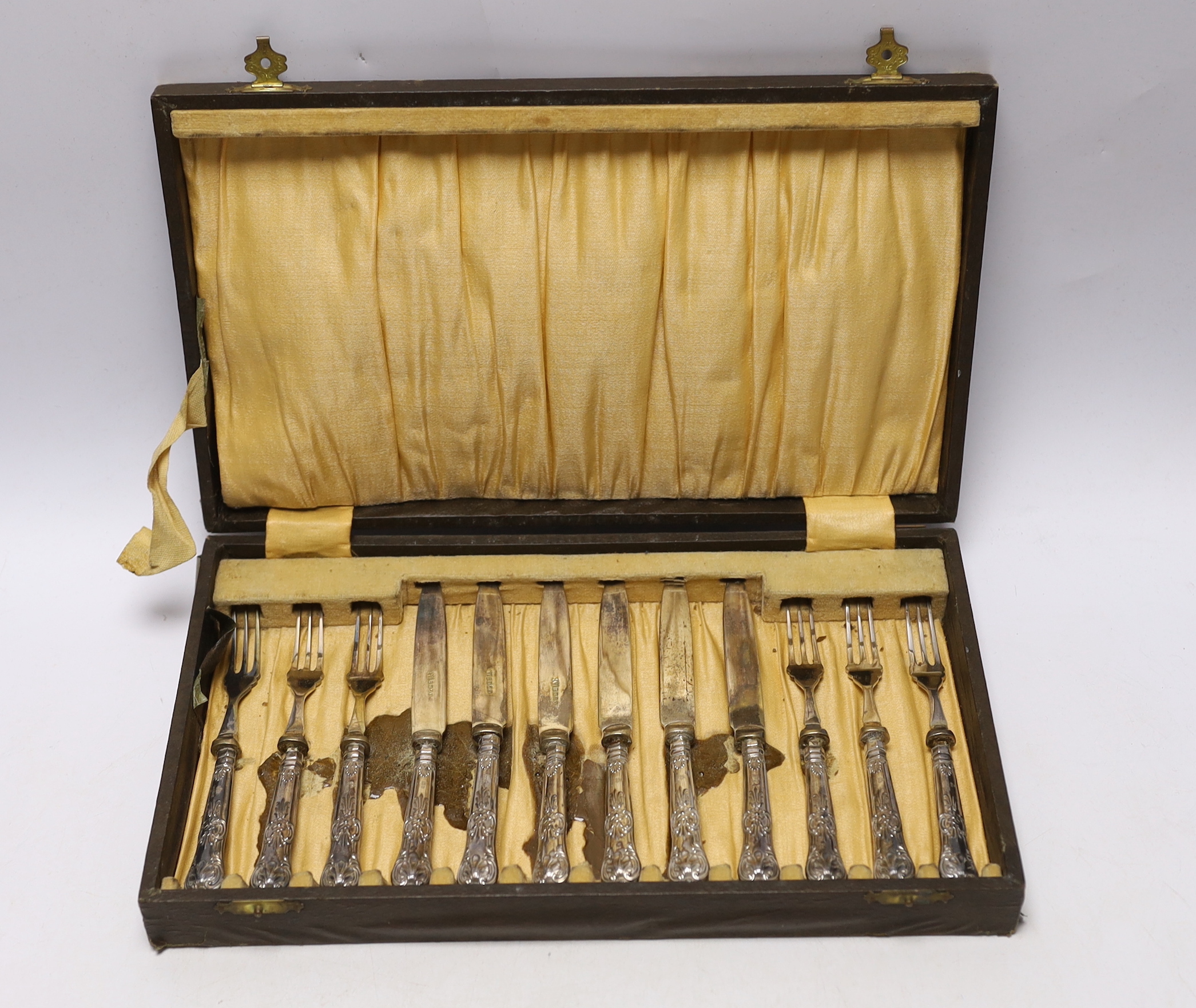 A cased set of six pairs of George V silver handled dessert eaters, C.H. Beatson, Sheffield, 1931.